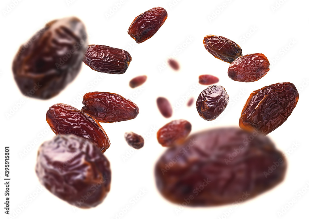 Dried dates levitate on a white background Dried dates levitate on a white background