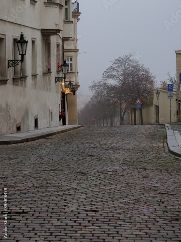 Empty Prague street an a foggy autumn morning