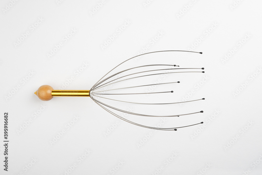 Head massage tool on white background. Relax, healthcare concept. Top view, flat lay, copy space Head massage tool on white background. Relax, healthcare concept. Top view, flat lay, copy space