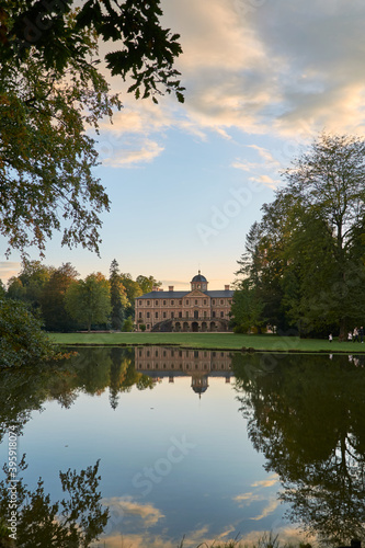 Rastatt Favorite Palace and idyllic palace garden with trees reflecting in pond at sunset