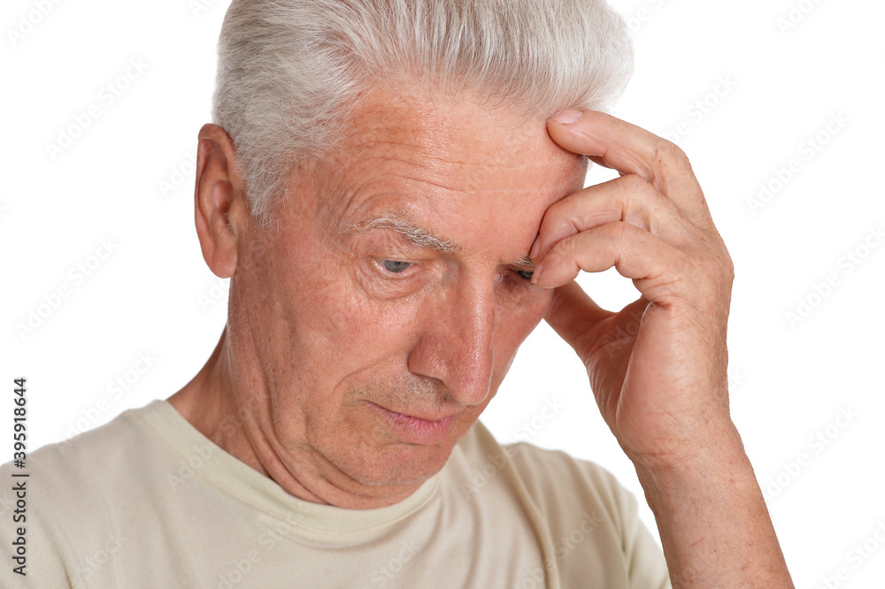 Thoughtful senior man holding hand on forehead Thoughtful senior man holding hand on forehead