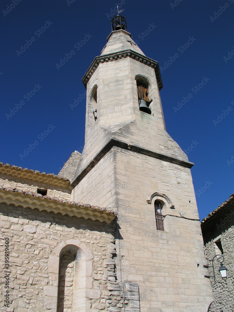 old church with bell tower against blue sky