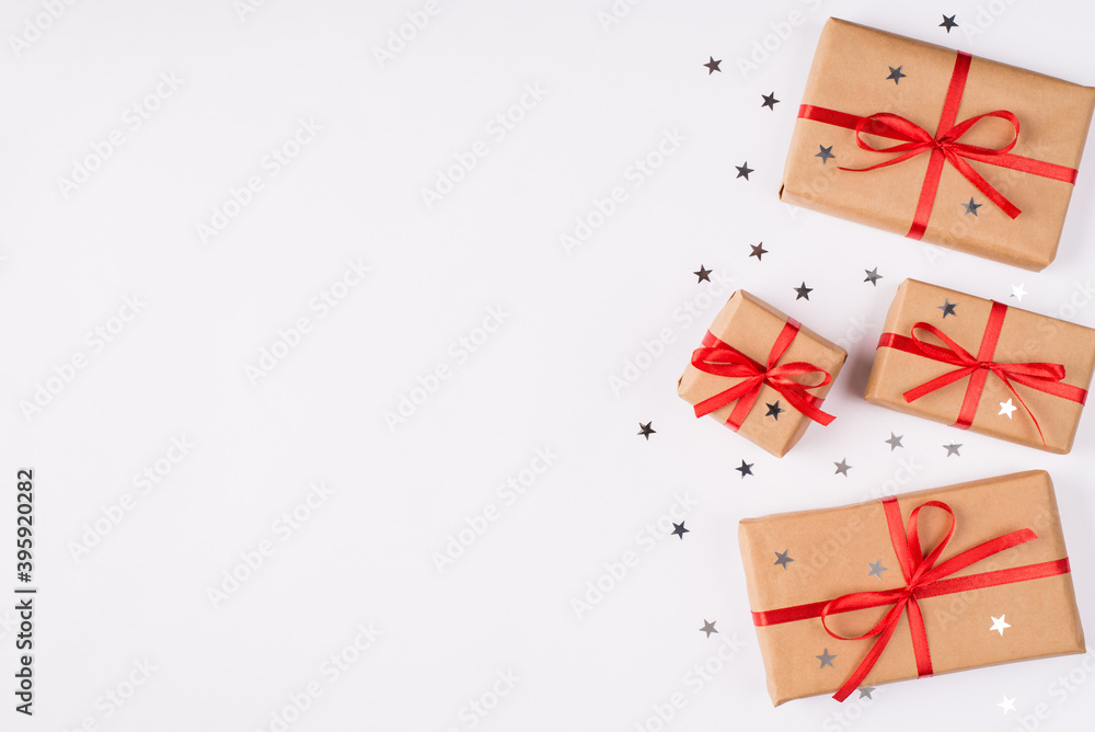 Top above flat lay close up view photo of present boxes wrapped in kraft paper isolated over white color background with copy empty blank space Top above flat lay close up view photo of present boxes wrapped in kraft paper isolated over white color background with copy empty blank space