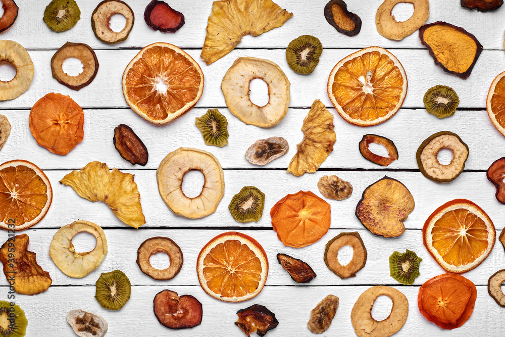 Mix of dried fruits on a wooden table Mix of dried fruits on a wooden table