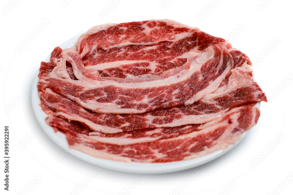 Fresh beef short plate slice on black plate, isolated on white background