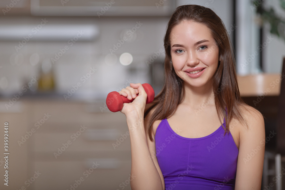 Portrait of a woman at home in the kitchen. Strength training and healthy eating. copycpase Portrait of a woman at home in the kitchen. Strength training and healthy eating. copycpase