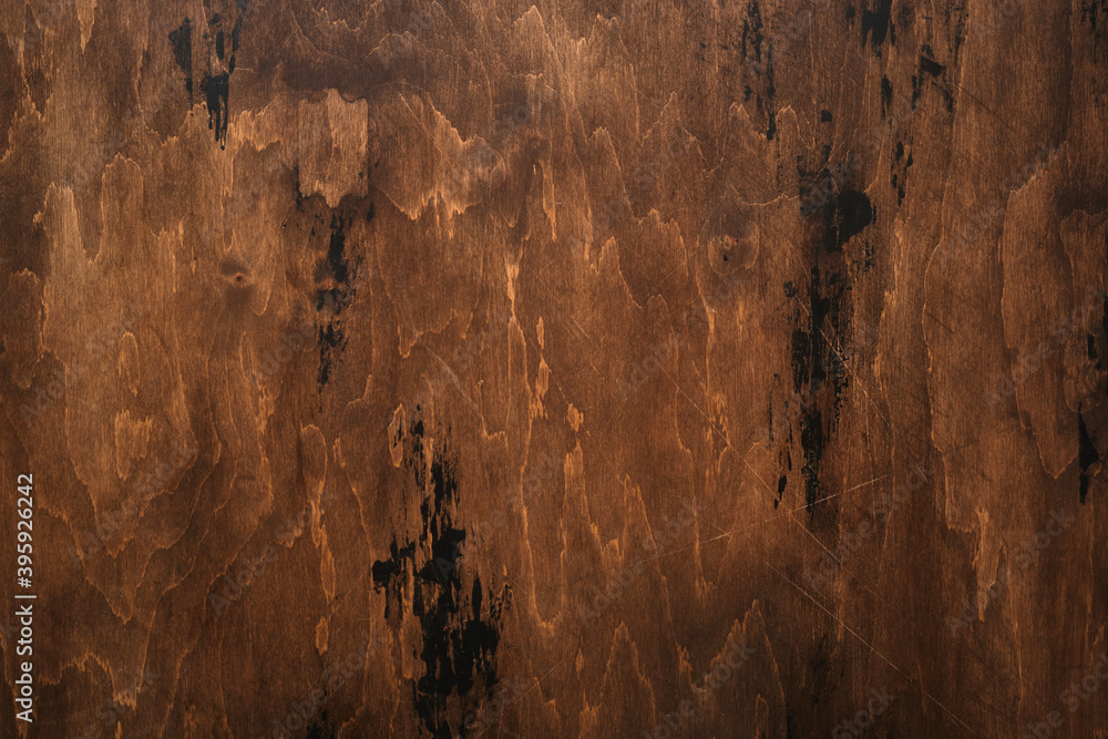 Fototapeta premium Brown scratched wooden background. Wood texture.