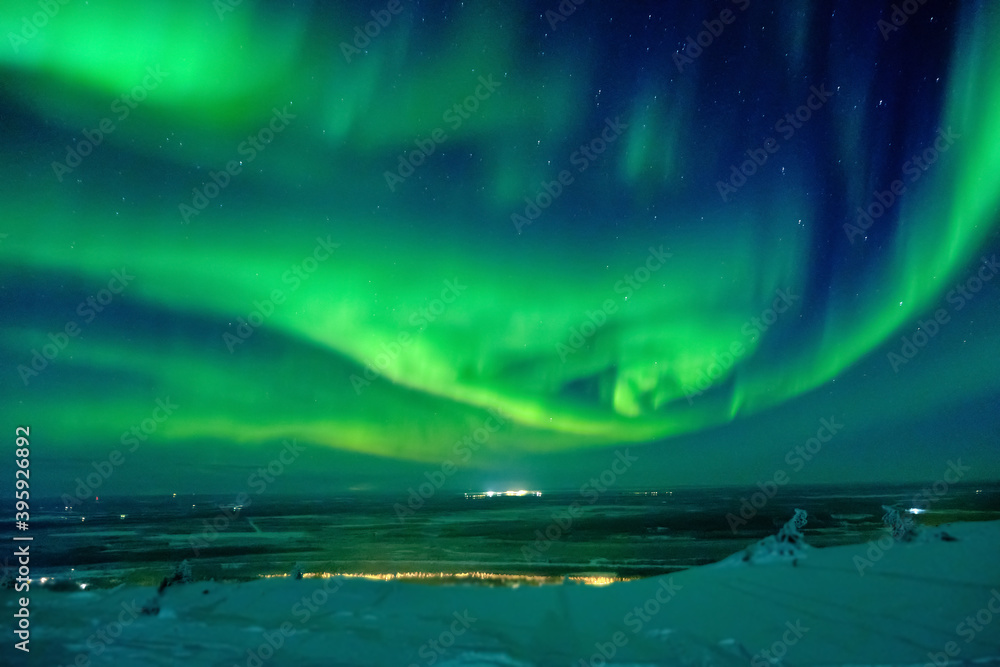 Naklejka Aurora borealis (northern or polar lights. Arctic Circle in winter Finland.