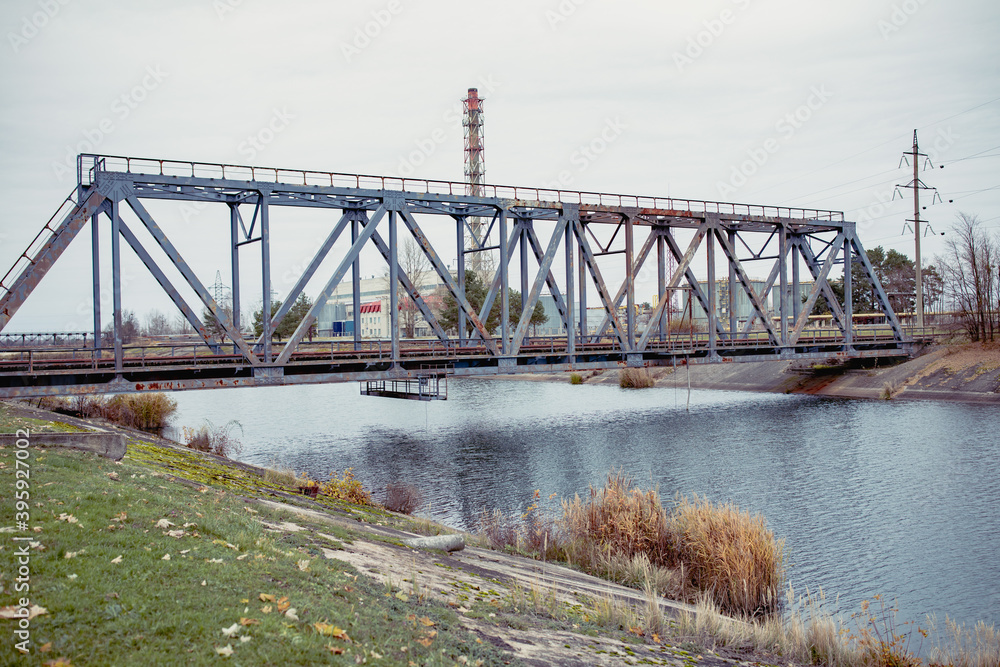 Railway bridge over the Pripyat river, Chernobyl. Metal structure, bridge supports. Bridge, years later, after the Chernobyl nuclear power plant.