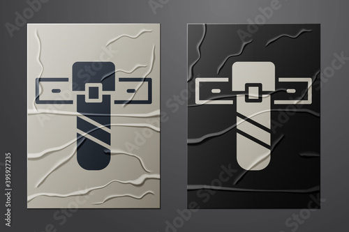 White Knife holster icon isolated on crumpled paper background. Paper art style. Vector.