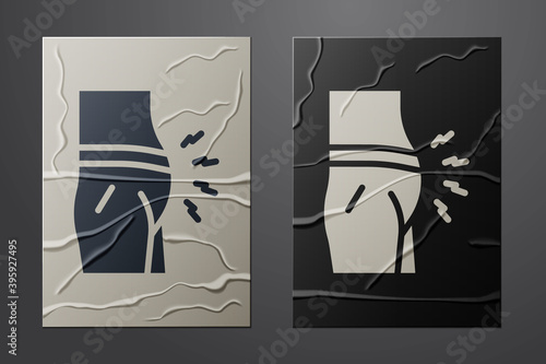 White Abdominal bloating icon isolated on crumpled paper background. Constipation or diarrhea. Paper art style. Vector.