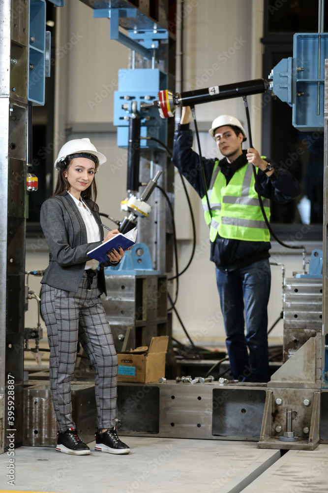 custom made wallpaper toronto digitalPortrait of a female factory manager in a white hard hat and business suit and factory engineer in work clothes. Controlling the work process in the manufacture.