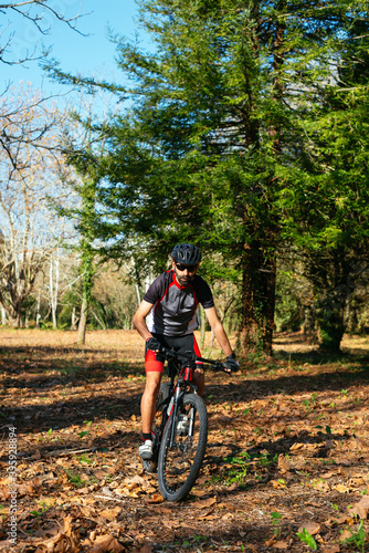 Young man riding a mountain bike.