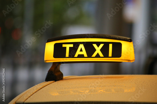 Close-up of taxi sign on yellow car