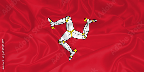 Isle of Man Flag waving. National flag of Isle of Man with waves and wind. Official colors and proportion. Manx Flag