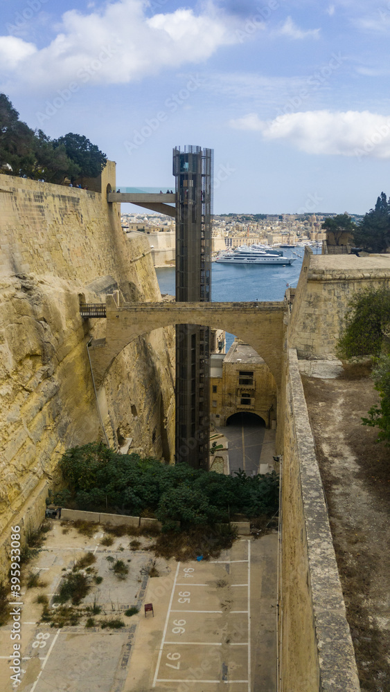 The Barrakka Lift built inside the defensive ditch links Lascaris Wharf to the Upper Barrakka Gardens in Valletta, Malta.
