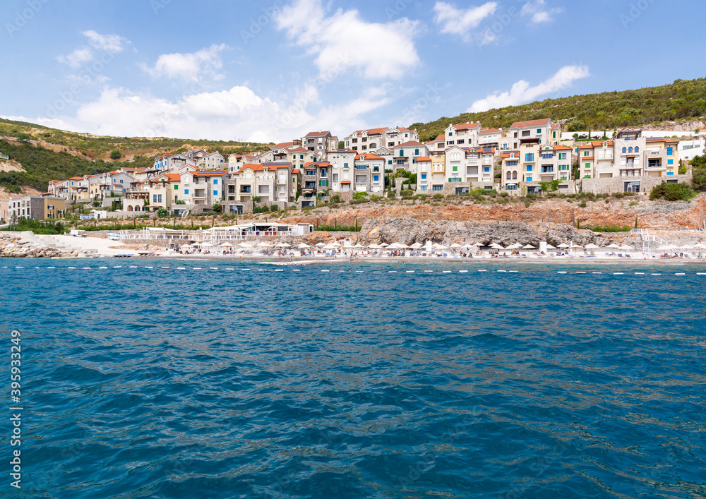 Beach and seaside village from the sea. Adriatic. Summer sunny day