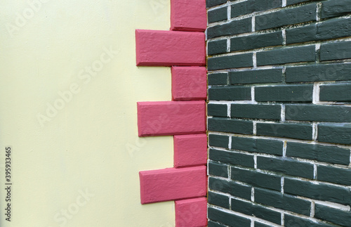 White wall background decorated with pink concrete And green bri