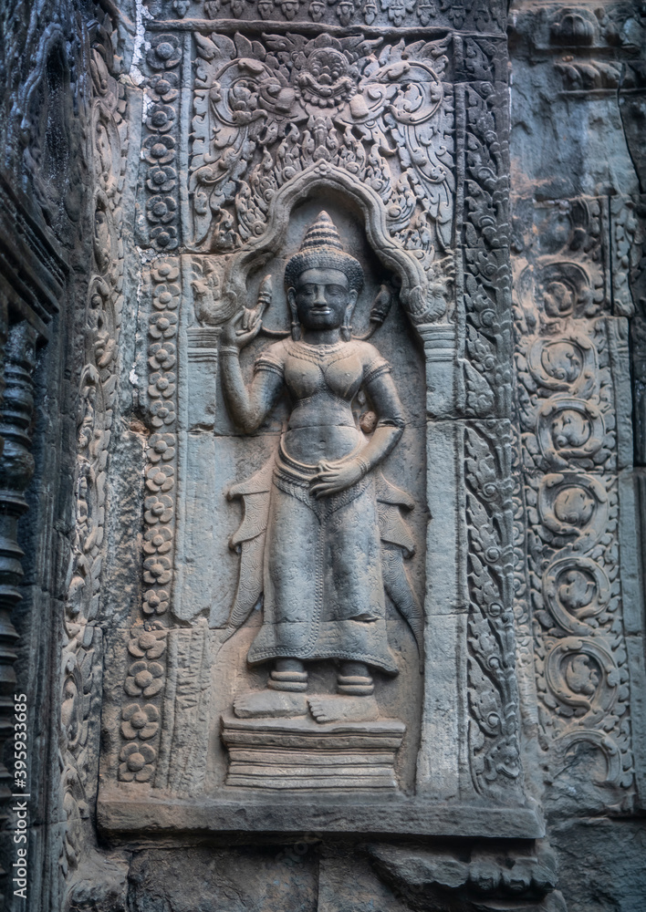 Та Prohm is the temple, it rains in the rainy season.The preserved symbiosis of stone and wood allows us to see Ta Prohm in this form.Bas-relief.(Cambodia, 04.10. 2019).