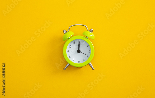 Alarm clock on a color background.
