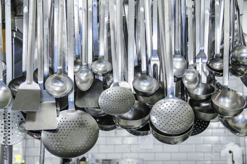 detail of hanging professional kitchen tools
