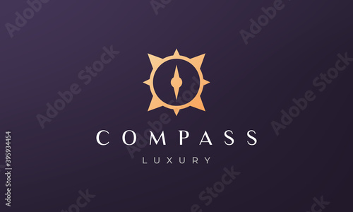 simple compass logo concept in a modern and luxury style with gold color