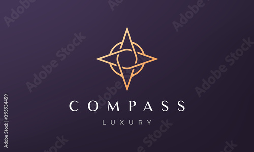simple compass logo concept in a modern and luxury style with gold color