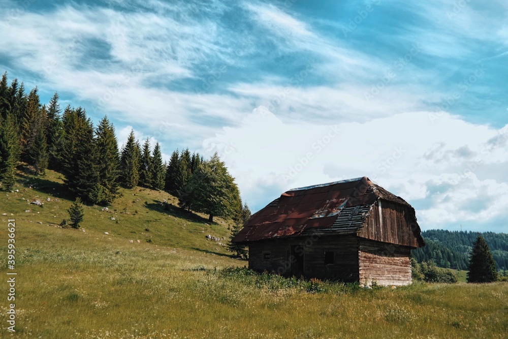 Abandoned wooden cabin in mountains Abandoned wooden cabin in mountains