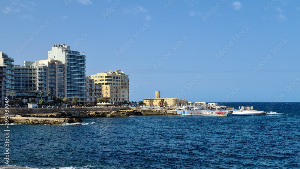 The seafront with the Sliema point battery, Sliema, Malta.