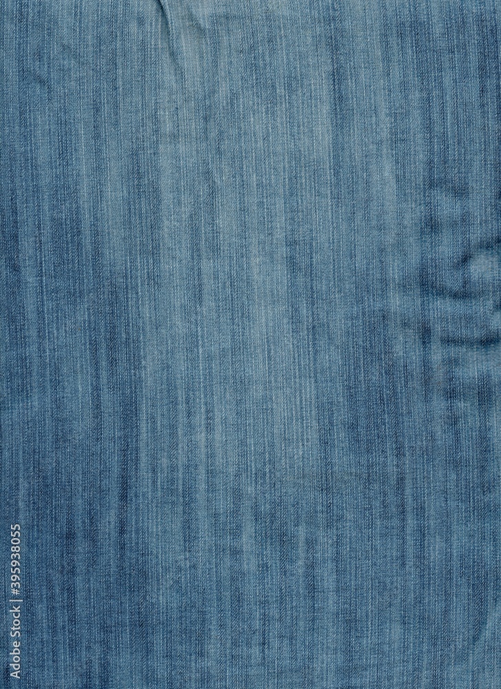 Denim background texture for design. Background from blue fabric Denim background texture for design. Background from blue fabric