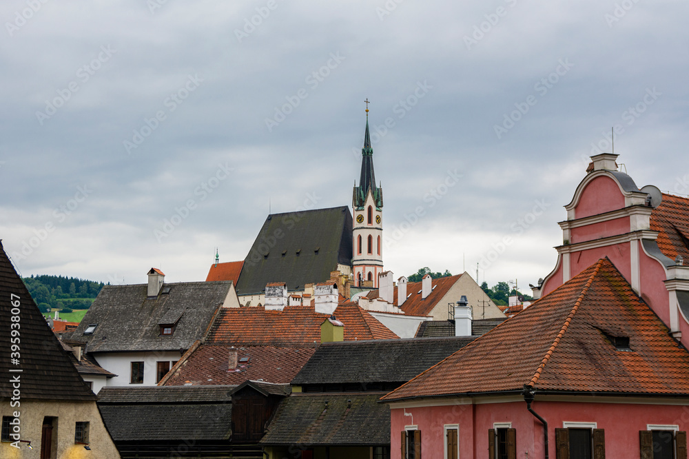 Fototapeta premium View to St. Vitus Church and roofs of Old Town of Cesky Krumlov, Czech Republic