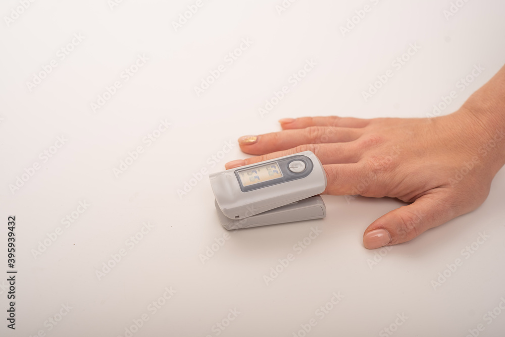 Female hand with a measuring device saturation. Blood oxygen level in coronavirus Female hand with a measuring device saturation. Blood oxygen level in coronavirus