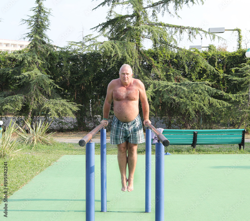 Fototapeta premium Senior adult engaged in outdoor exercise, physical activity, healthy lifestyle