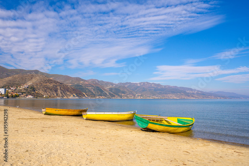 Wooden boats at pier on mountain lake