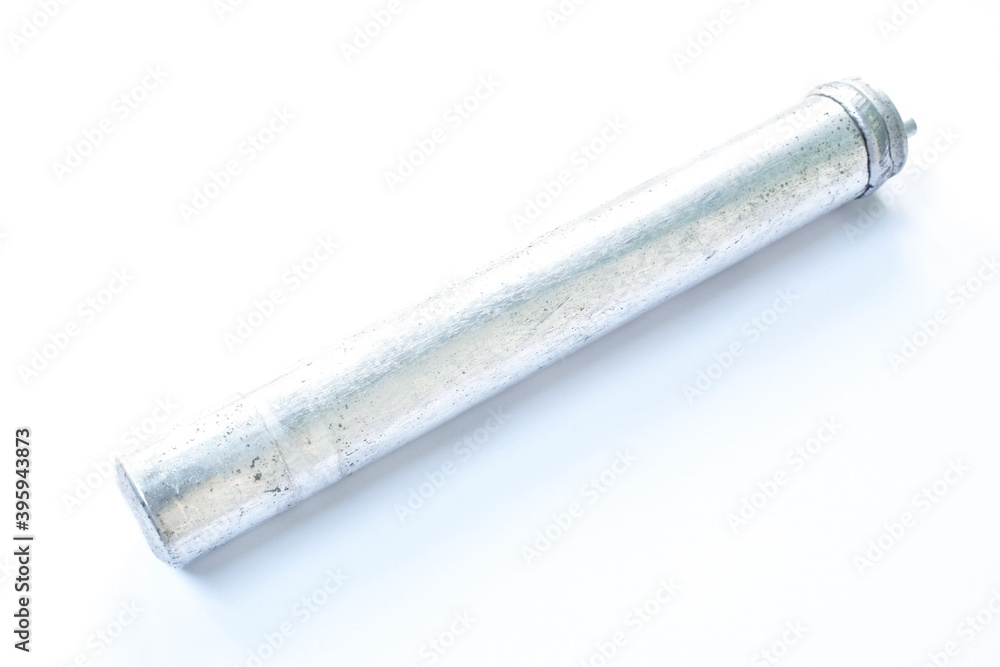 broken receiver dryer for car air conditioner on white background broken receiver dryer for car air conditioner on white background