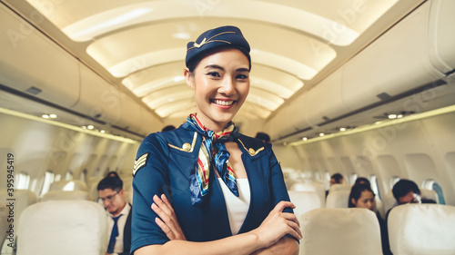 Valokuva Cabin crew or air hostess working in airplane