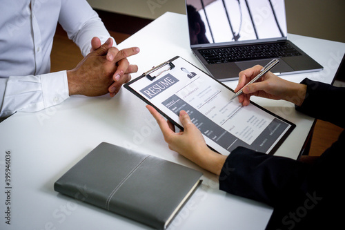 ..close up view of finance company interviews The head of the HR department focuses on writing a special resume of the applicant that can be used to help develop the company. Recruitment concepts