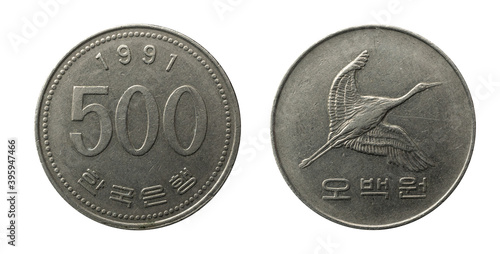 1991 coin from South Korea representing a flying manchurian crane, value of 500 won, obverse and reverse.