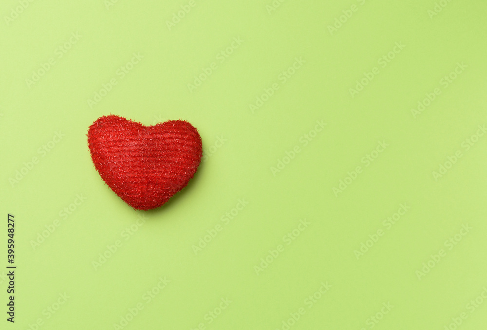 red heart on a green background red heart on a green background