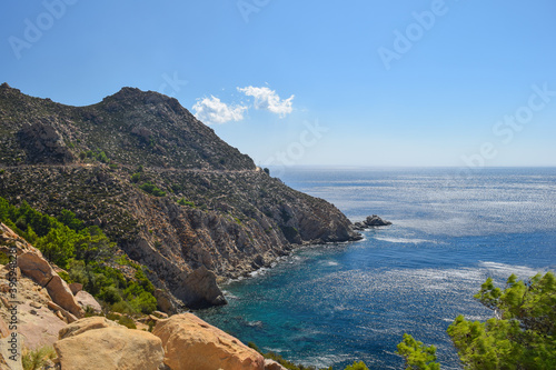 Canvas Print Ikaria coastline cliff landscape with aegean sea byside