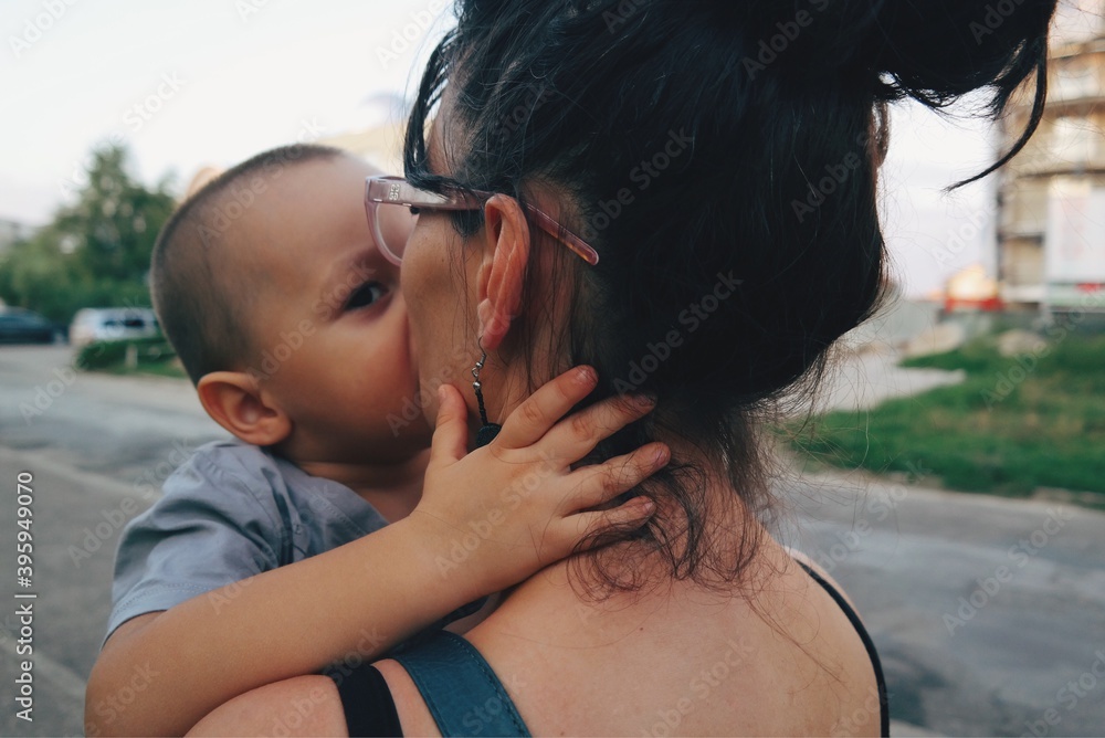 Fototapeta premium parent kissing their child