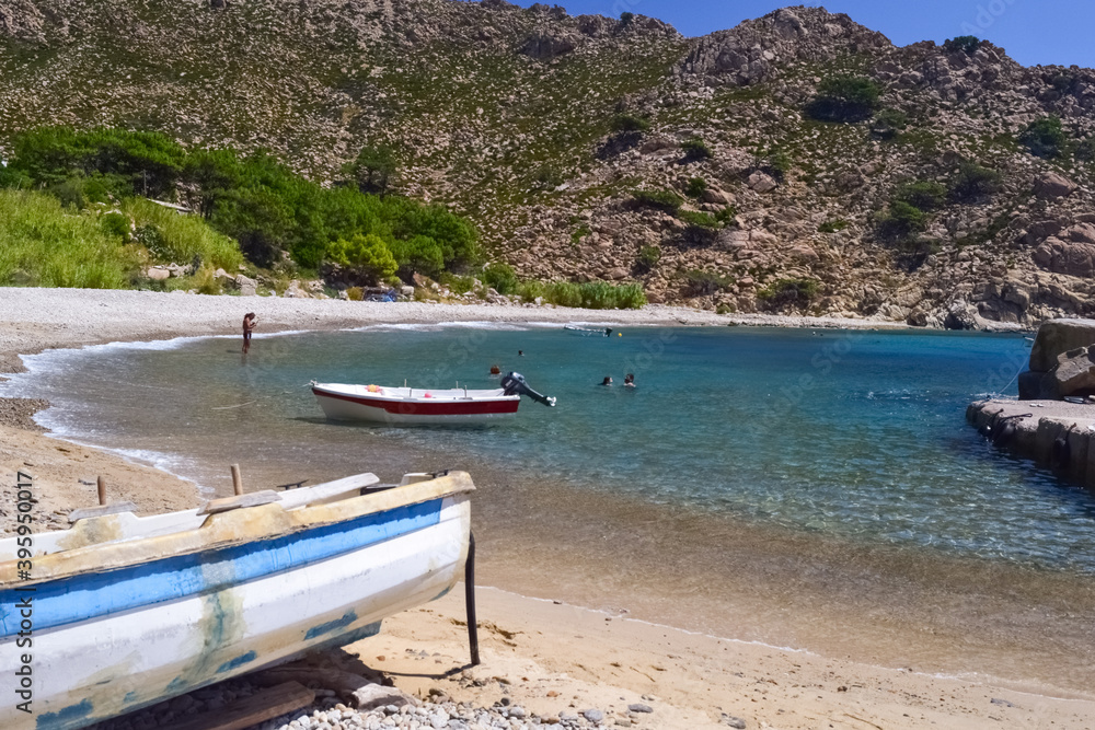 Boats at the shore of a marvelous beach in Trapalo, Ikaria