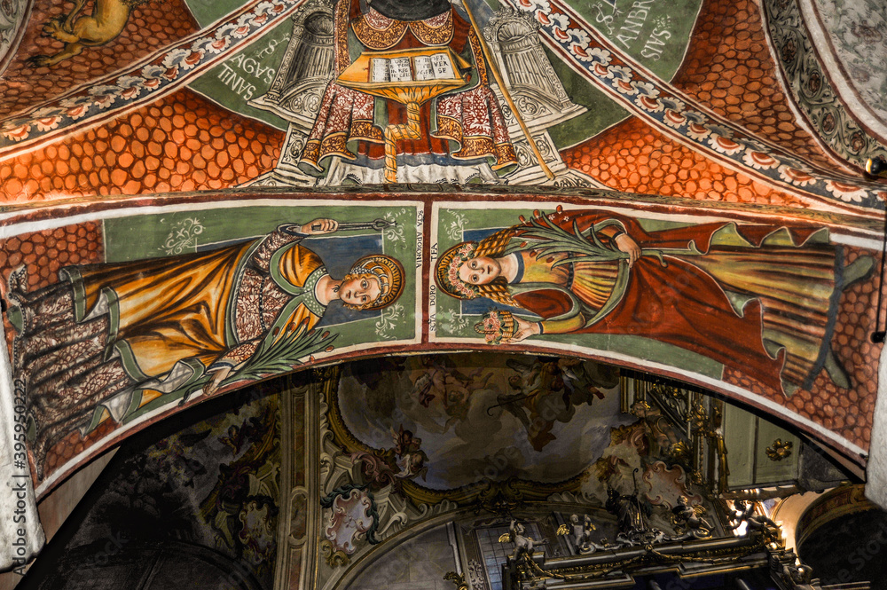 Naklejka premium Italy / San Giulio Island 09/13/2014 Most of the surviving frescoes are made by Sperindio Cagnola, who belonged to the Lombard school of artists and was influenced by Gaudenzio Ferrari. 
