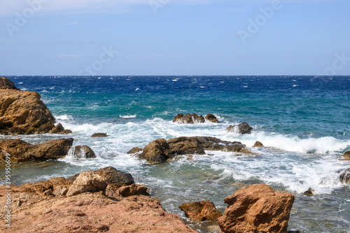 Koumbara beach located in a rocky bay on Ios Island. Greece