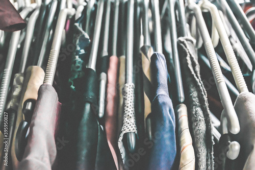 Picture of second hand clothes on the hangers. photo