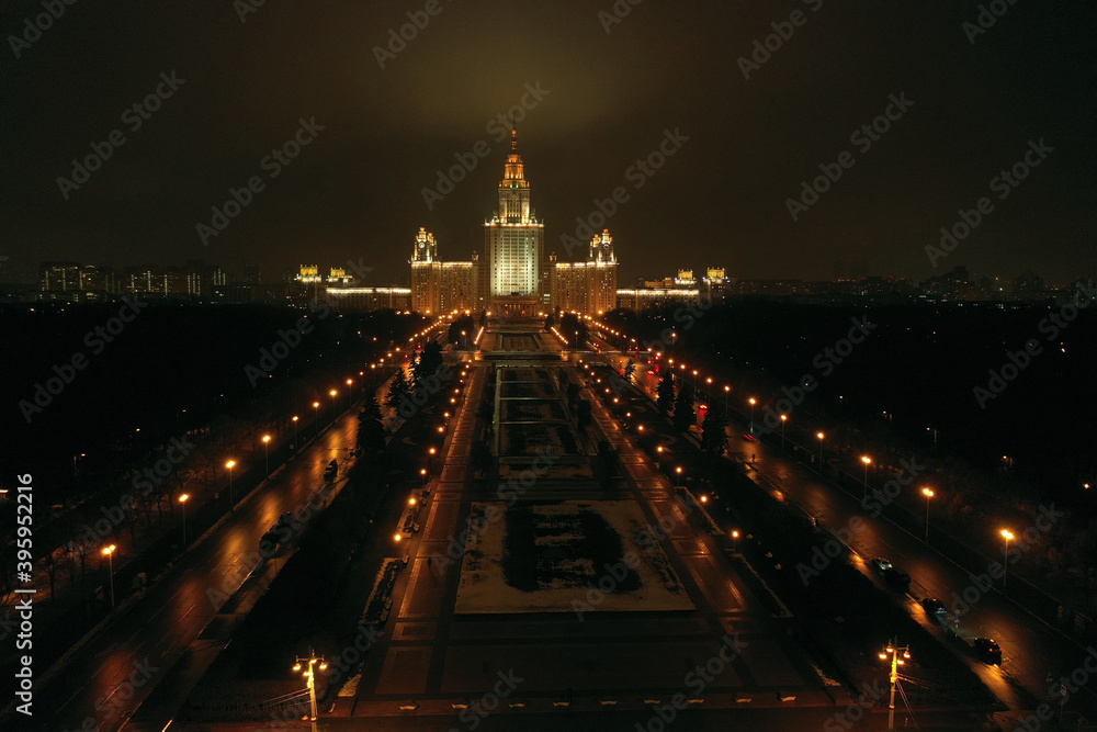 Fototapeta premium a panoramic view of the night city from a bird's eye view shot from a drone
