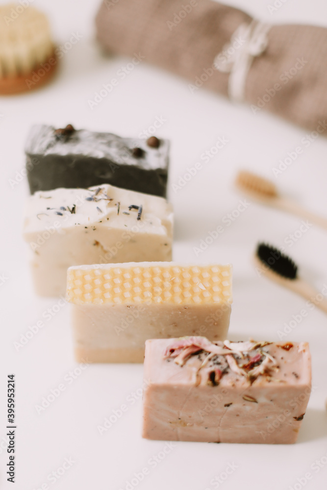 Soap bars, organic cosmetic products on white table, eco-friendly bathroom items. Zero waste. Plastic free. flat lay, top view
