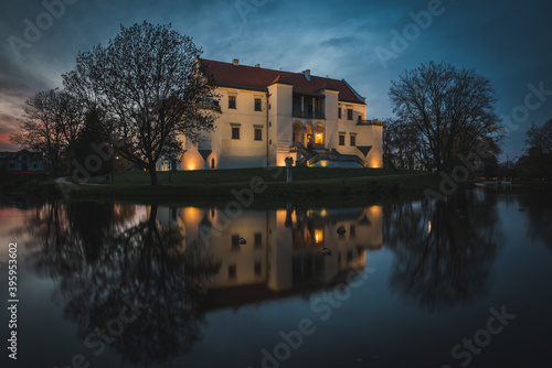 Szydlowiec castle on an island surrounded by a moat.