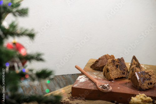 panettone and chocotone on a table with ingredients photo