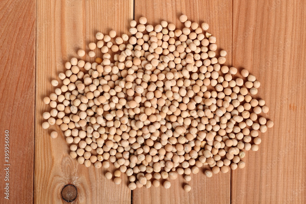 Whole yellow peas at wooden plank background Whole yellow peas at wooden plank background